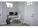 Functional home office with desk, computer setup, and a bright, inviting door at 813 Burlington N Ave, St Petersburg, FL 33701