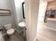 Stylish powder room featuring a vessel sink, modern fixtures, and a convenient decorative shelf at 813 Burlington N Ave, St Petersburg, FL 33701