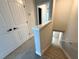 Staircase with carpeted steps and white railing leading to the upper level at 813 Burlington N Ave, St Petersburg, FL 33701