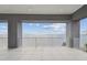 Serene covered balcony provides panoramic views of the water at 90 Martinique Ave, Tampa, FL 33606