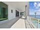 Spacious outdoor balcony with a dining area and waterfront view, perfect for relaxing and entertaining at 90 Martinique Ave, Tampa, FL 33606