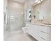 Well-lit bathroom with glass shower, floating vanity, and modern fixtures at 90 Martinique Ave, Tampa, FL 33606
