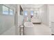 Bright bathroom with a modern soaking tub, marble shower, and sleek vanity with ample storage at 90 Martinique Ave, Tampa, FL 33606
