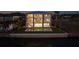 The rear exterior of this home features a walkout to the pool and manicured lawn, perfect for enjoying outdoor living at 90 Martinique Ave, Tampa, FL 33606