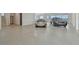 Spacious garage featuring luxury vehicles and epoxy floors, blending functionality with upscale design at 90 Martinique Ave, Tampa, FL 33606