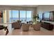 Bright living room with floor to ceiling windows boasting scenic water views and cozy seating at 90 Martinique Ave, Tampa, FL 33606