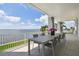 Spacious covered patio with a large dining table and chairs overlooking the beautiful water view at 90 Martinique Ave, Tampa, FL 33606