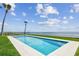 This immaculate pool offers endless fun in the sun and scenic ocean views with manicured lawn at 90 Martinique Ave, Tampa, FL 33606