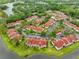 Expansive aerial view showcases a well-maintained community with serene lakes and lush green spaces at 9481 Highland Oak Dr # 1206, Tampa, FL 33647