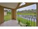 Relaxing balcony showcases views of lush greenery and tranquil lake, ideal for enjoying the outdoors at 9481 Highland Oak Dr # 1206, Tampa, FL 33647
