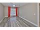 Bedroom featuring stylish wood-look flooring and bright natural light at 9481 Highland Oak Dr # 1206, Tampa, FL 33647