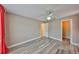 Bedroom featuring stylish wood-look flooring and bright natural light at 9481 Highland Oak Dr # 1206, Tampa, FL 33647