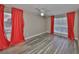 Bedroom featuring stylish wood-look flooring and bright natural light at 9481 Highland Oak Dr # 1206, Tampa, FL 33647
