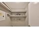 Functional laundry room with built-in shelving, and utility connections provides convenience at 9481 Highland Oak Dr # 1206, Tampa, FL 33647