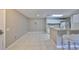 Open layout with tiled floors, kitchen view, and cozy barstool seating at 9481 Highland Oak Dr # 1206, Tampa, FL 33647