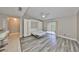 The spacious living room features a murphy bed and sliding glass doors to a patio at 9481 Highland Oak Dr # 1206, Tampa, FL 33647