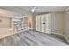 Open-concept living room with stylish flooring and built-in shelving at 9481 Highland Oak Dr # 1206, Tampa, FL 33647