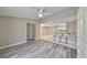 Spacious living room featuring stylish wood-look flooring and bright natural light at 9481 Highland Oak Dr # 1206, Tampa, FL 33647