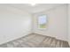 Bright bedroom features a window with a view and neutral decor, creating a serene and comfortable atmosphere at 10418 Cross River Trl, Parrish, FL 34219