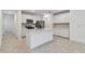Bright kitchen with white cabinets, stainless steel appliances, and a large island at 10418 Cross River Trl, Parrish, FL 34219