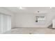 Bright and airy living room with tile floors, and sliding glass door at 10418 Cross River Trl, Parrish, FL 34219