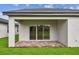 Covered outdoor patio with a brick-paved floor and a clear view of the backyard at 10418 Cross River Trl, Parrish, FL 34219