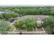 Aerial view of townhomes with lush green trees and ample parking at 10906 Keys Gate Dr, Riverview, FL 33579