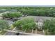 Community aerial view showcasing well-manicured landscaping, mature trees, and ample parking at 10906 Keys Gate Dr, Riverview, FL 33579
