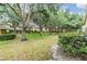 Lush backyard offering a serene and private outdoor space within the townhouse community at 10906 Keys Gate Dr, Riverview, FL 33579