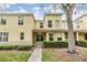 Inviting townhome with manicured bushes, a small porch, and a tidy front yard at 10906 Keys Gate Dr, Riverview, FL 33579