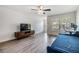Comfortable living room with wood floors, furniture, and an open window with natural light at 10906 Keys Gate Dr, Riverview, FL 33579