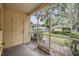 Enclosed patio with a view of the yard, providing a tranquil space for outdoor relaxation at 10906 Keys Gate Dr, Riverview, FL 33579