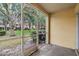 Enclosed patio with a view of the yard, perfect for relaxation and enjoying the outdoor scenery at 10906 Keys Gate Dr, Riverview, FL 33579