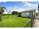 Fenced backyard featuring a well maintained lawn and an air conditioning unit at 11602 Innfields Dr, Odessa, FL 33556