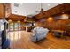 View of the finished basement featuring a bar, fireplace, and hardwood flooring throughout the entire room at 11602 Innfields Dr, Odessa, FL 33556