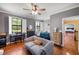 Cozy bedroom with a seating area, natural light, and comfortable furnishings, creating a relaxing atmosphere at 11602 Innfields Dr, Odessa, FL 33556