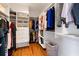 Walk-in closet with custom shelving and ample storage space for clothes, shoes, and accessories at 11602 Innfields Dr, Odessa, FL 33556