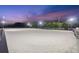 Equestrian arena illuminated at night, showcasing the extensive riding space at 11602 Innfields Dr, Odessa, FL 33556