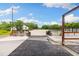 View of an equestrian arena complete with fencing, a riding surface, seating, and well-maintained surroundings at 11602 Innfields Dr, Odessa, FL 33556