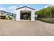 Exterior of a large metal garage, showing ample parking in the front at 11602 Innfields Dr, Odessa, FL 33556