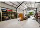 Spacious garage interior with ample storage, a toilet, and workspace for various activities at 11602 Innfields Dr, Odessa, FL 33556