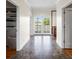 Hallway with marble floors, access to the backyard, walk-in closet, and vanity makes this home convenient at 11602 Innfields Dr, Odessa, FL 33556