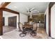 Covered patio with outdoor kitchen including grill, counter space and dining area at 11602 Innfields Dr, Odessa, FL 33556