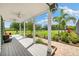 Inviting back porch with plenty of space to sit and enjoy the scenery at 11602 Innfields Dr, Odessa, FL 33556