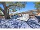 Relaxing back deck with a luxurious hot tub and comfortable seating for enjoying the beautiful outdoors at 1513 Owen Dr, Clearwater, FL 33759