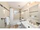Bathroom features a tub shower combination, neutral decor, and large vanity at 1513 Owen Dr, Clearwater, FL 33759