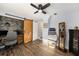 Bedroom boasts wood floors, natural light, and a sliding barn door to an office at 1513 Owen Dr, Clearwater, FL 33759