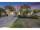 Charming single-story home with a well-manicured lawn, mature trees, and a welcoming blue front door at 1513 Owen Dr, Clearwater, FL 33759