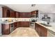 Modern kitchen featuring custom cabinets, granite countertops, and stainless steel appliances at 1513 Owen Dr, Clearwater, FL 33759