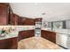 Well-equipped kitchen with granite countertops, stainless steel appliances, and custom cabinets at 1513 Owen Dr, Clearwater, FL 33759